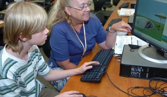 Patty Harrington, right, and a student from North Davie Middle School participate in a virtual world workshop at Appalachian State University. [Photo courtesy of Appalachian State University.] 