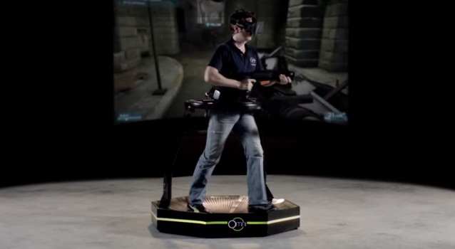 Creator Jan Goetgeluk demonstrates the treadmill, playing a first-person shooter with an Oculus Rift.