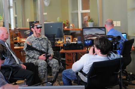 Sgt. Stephanie Bacon of the 191st Training Brigade demonstrates a virtual reality PTSD therapy for a documentary crew at Joint Base Lewis-McChord, Wash. ( Photo courtesy by Maj. Matt Lawrence, 807th MDSC Public Affairs)