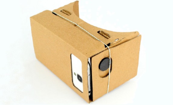 The first generation Google Cardboard headset with a magnet on the side.