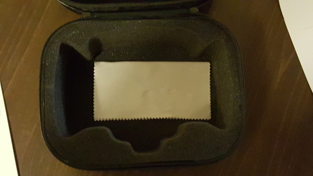 Padded carrying case, with lens cloth.