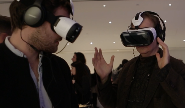 Audience viewing "Seeking Home: Life Inside the Calais Migrant Camp," a VR experience placing viewers at the center of the migrant camp via Samsung Gear VR. (AP Photo)